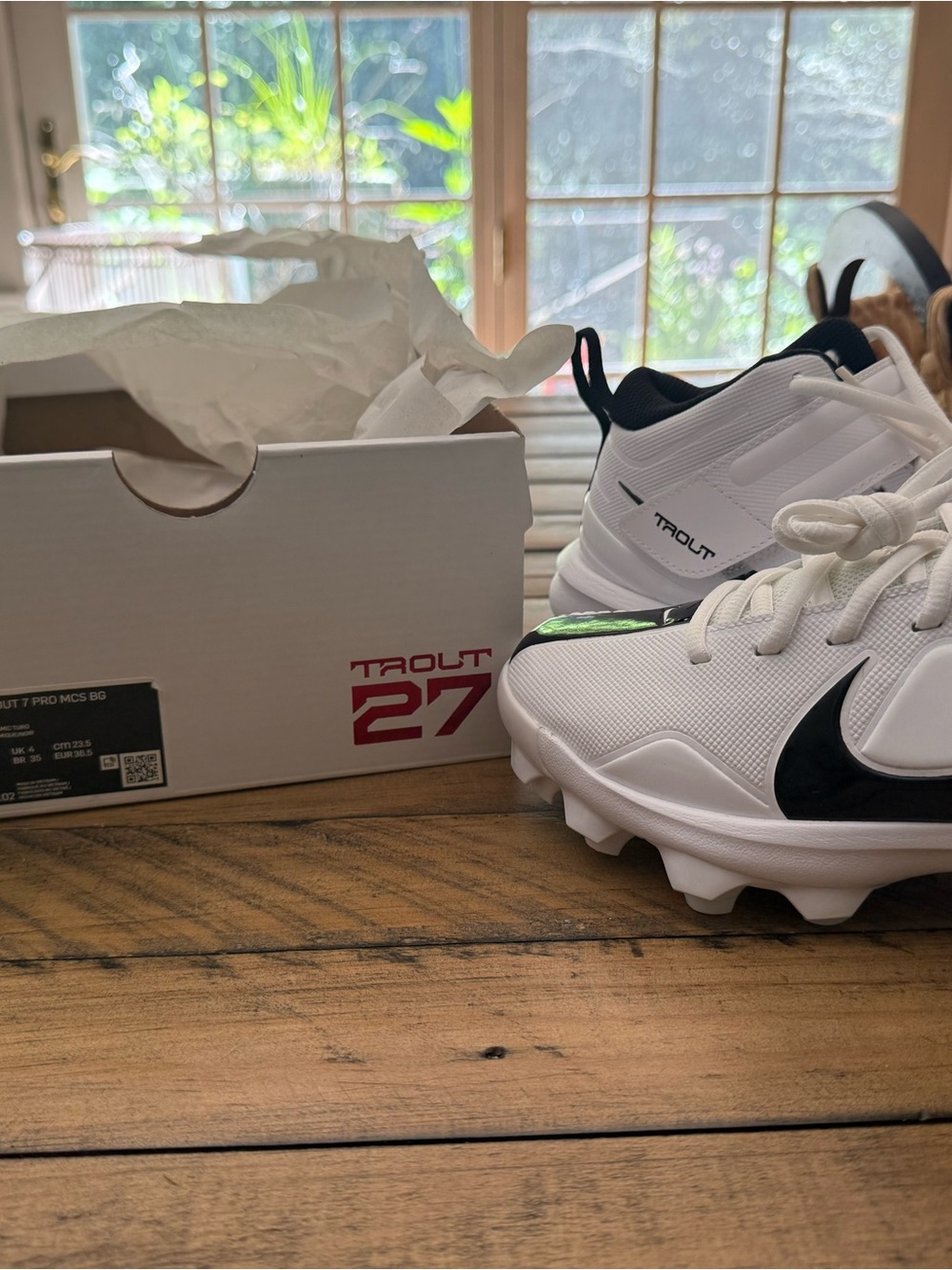 Nike Kids White and Black Cleat Sneakers with Green Accent